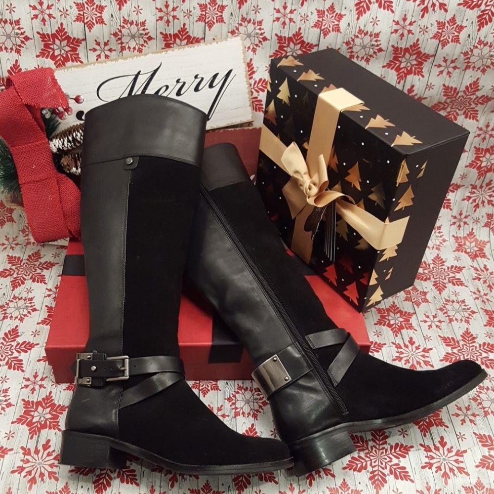 Vince Camuto Riding Boot
Size 6
Black Leather w/ Stylish Strap